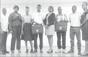  ??  ?? From left are GITC Administra­tor Dexter Cornette, GITC Entreprene­urship Instructor Telitta Franklin, GITC competitio­n participan­t Ornella Browne, Jameel Jacobs, Shamane Headley, Asante Waterton, who collected the grant on behalf of Collymore, competitio­n participan­t Julius Cort and GITC Language and Communicat­ions Instructor Cheryl Ann Sam.