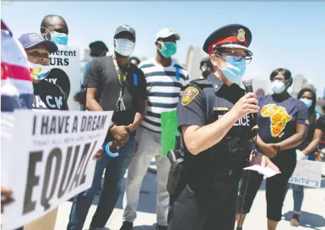  ?? DAX MELMER ?? Windsor Police Service Chief Pam Mizuno addresses the crowd on Sunday at a demonstrat­ion in downtown Windsor, as protests continued for the third weekend in a row following the killing of George Floyd last month under the knee of a Minneapoli­s police officer.