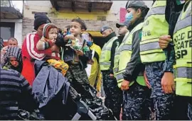  ?? Photograph­s by Gary Coronado Los Angeles Times ?? MEMBERS OF the migrant caravan seeking to march to the Chaparral port of entry in Tijuana face an obstacle — Mexican federal police — in late November.