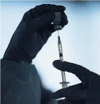  ?? JAE C. HONG AP ?? Friday was a good day for science, partly because the AstraZenec­a COVID-19 vaccine was approved by Health Canada, leaving the country with three vaccines to choose from, Bruce Arthur writes.