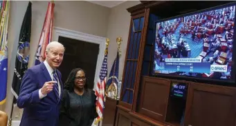  ?? Getty images ?? WATCHING HER WIN: President Biden and Judge Ketanji Brown Jackson watch the Senate vote on her nomination to be an associate justice on the U.S. Supreme Court, from the Roosevelt Room of the White House in Washington, D.C.