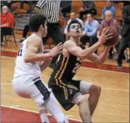  ?? GENE WALSH — DIGITAL FIRST MEDIA ?? CB West’s Jack Mulhearn looks to shoot as Plymouth Whitemarsh’s Danny Cooper defends.