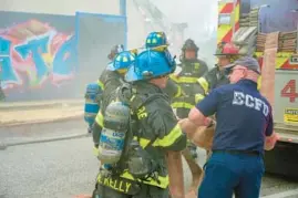  ?? ?? The two-alarm fire started around 1:35 p.m. Wednesday and spread to a vacant warehouse adjacent to the metal yard, a fire department spokespers­on said.