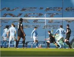  ?? Associated Press ?? ↑
Manchester City’s John Stones (second right) scores a goal against West Ham during their English Premier League match on Saturday.