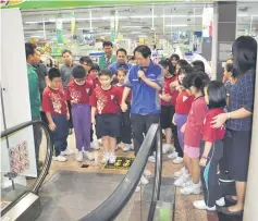  ??  ?? Albert Kong from Mitsubishi Elevator (M) Sdn Bhd conducting practical training for children on safe use of escalators.