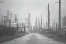  ?? JOE RAEDLE, GETTY IMAGES ?? As Harvey comes ashore many of the country’s oil refineries are in its path and have had to shut down.