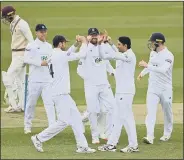  ??  ?? HITTING BACK Mohammad Abbas, second right, celebrates a wicket after Hampshire had been routed for 79