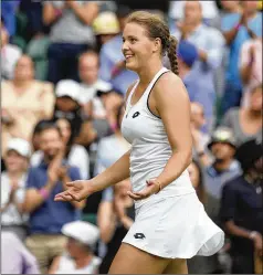  ?? KIRSTY WIGGLESWOR­TH/AP ?? Germany’s Jule Niemeier celebrates after defeating Britain’s Heather Watson in fourth-round singles at Wimbledon. Niemeier next faces Germany’s Tatjana Maria for a place in the semifinals.