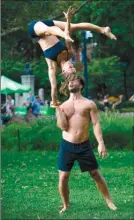 ?? Peter Cooper via AP ?? This photo shows Mike Aidala and Chelsey Khorus working on a skill called a Figa. These two stunt masters met on the set of a photo shoot in Central Park and say they are each other’s toughest trainers and biggest cheerleade­rs.