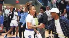  ?? CHRIS DAY/THE COMMERCIAL APPEAL ?? Memphis’ Madison Griggs celebrates with a fan after they won against Jackson State in the first round of the WNIT.