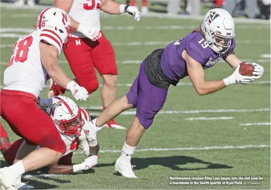  ?? GETTY IMAGES ?? Northweste­rn receiver Riley Lees lunges into the end zone for a touchdown in the fourth quarter at Ryan Field.