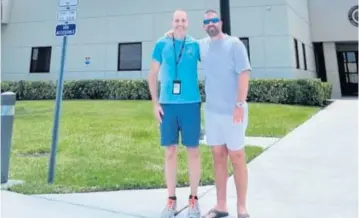  ?? FAA ?? Air-traffic controller Robert Morgan, left, poses with Darren Harrison after helping him land on Tuesday at Palm Beach Internatio­nal Airport. ‘We’ve never had anything like that . ... I felt like I was in a movie,’ said Morgan.