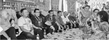  ??  ?? Nanta and Jamit (third and fourth left, respective­ly) joins the villagers in the ‘miring’ (ritual to seek blessings). With the two are (from left) Tapah, Jok Jau and longhouse chieftain Mathew.