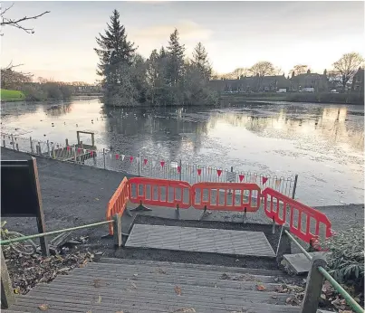  ?? Picture: Paul Reid. ?? Barriers used during resurfacin­g of the path at Keptie Pond were vandalised.