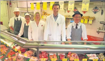  ?? Main picture: Paul Reid. ?? Guthrie Batchelor, second right, with staff at Fleming’s in Arbroath. Below: an old photo of a Fleming’s delivery van.