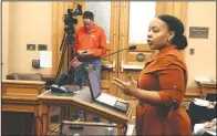  ?? (File Photo/AP/John Hanna) ?? Michele Watley, founder of Shirley’s Kitchen Cabinet, testifies in January in favor of a bill before the Kansas Legislatur­e to ban discrimina­tion based on hairstyles in employment, housing and public accommodat­ions during a committee hearing at the Statehouse in Topeka, Kan. A growing number of states, such as New Mexico, are facing pressure to ban race-based discrimina­tion against hair texture and hairstyles in schools and in the workplace.