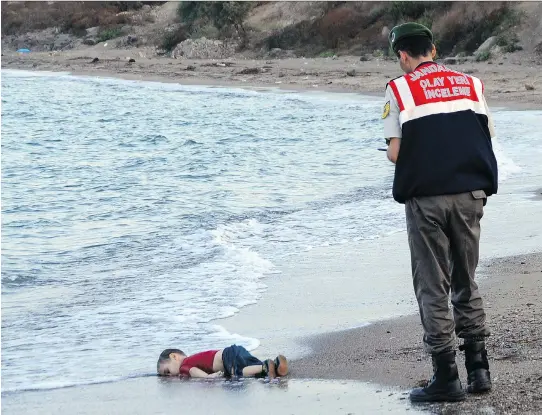  ?? THE ASSOCIATED PRESS ?? The image that changed the world’s conversati­on about Syrian refugees: The lifeless body of Alan Kurdi, 3, on the beach at Bodrum, Turkey.