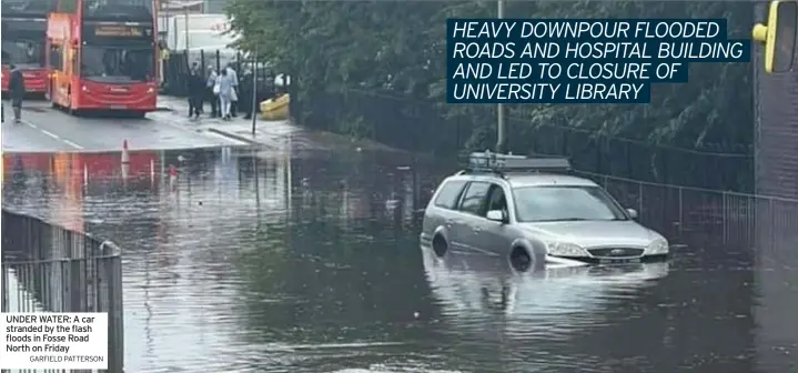  ?? GARFIELD PATTERSON ?? UNDER WATER: A car stranded by the flash floods in Fosse Road North on Friday