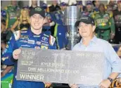  ?? JERRY MARKLAND/GETTY IMAGES ?? Kyle Busch’s pass on a late restart put him out front and he rode the clean air at Charlotte to victory on Saturday.