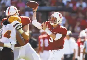  ?? Ezra Shaw / Getty Images ?? K.J. Costello played well against UCLA (leading nine scoring drives) and against Arizona State (above) in support of Bryce Love.