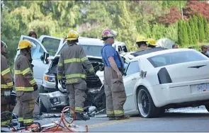  ?? Penticton Herald file photo ?? First responders work the scene of a July 21, 2017, crash near Vaseux Lake that rendered one victim a quadripleg­ic.