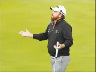  ?? Matt Dunham / Associated Press ?? J.B. Holmes reacts after putting on the 18th green during the third round of the British Open at Royal Portrush