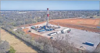  ?? [OKLAHOMAN ARCHIVES] ?? A rig drills a well in late 2018 in south Oklahoma City. Production of oil and natural gas from U.S. wells in November set another record as production costs continue to fall.