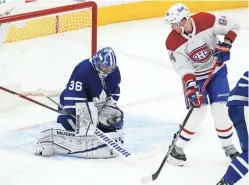  ?? JOHN E. SOKOLOWSKI-USA TODAY SPORTS ?? Maple Leafs goaltender Jack Campbell (36) makes a glove save as Canadiens forward Corey Perry (94) looks for a rebound on Wednesday.