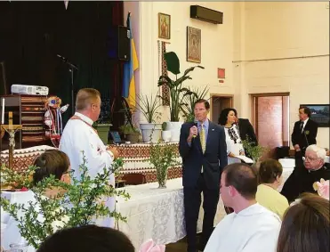  ?? Raga Justin/ Hearst Connecticu­t Media ?? U.S. Sen. Richard Blumenthal, D-Conn., addresses Ukrainian refugees and members of the St. Michael the Archangel Ukrainian Catholic Church in New Haven on Sunday.