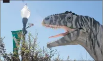  ??  ?? A 20-foot Tyrannosau­rus rex welcomes visitors to the Field House of Natural History in Vernal, Utah. The state has what scientists believe is the world’s largest concentrat­ion of bones of carnivorou­s dinosaurs.