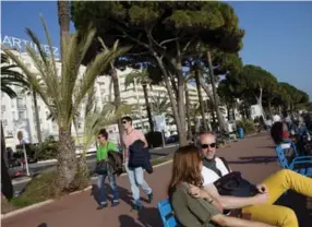  ?? REBECCA MARSHALL FOR THE NEW YORK TIMES ?? Sitting and strolling along the seaside promenade known as La Croissette is a great way to spend an afternoon in Cannes, roughly 160 kilometres east of Marseille on the Riviera.