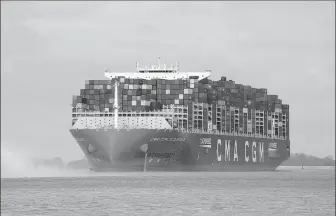  ?? The huge container ship CMA CGM Jacques Saade sails on the Elbe River toward the port of Hamburg, Germany, on May 3. MARCUS BRANDT / DPA VIA ASSOCIATED PRESS ??