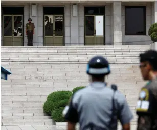  ?? (Reuters) ?? A NORTH KOREAN soldier keeps watch toward the south at the truce village of Panmunjom, South Korea, yesterday.