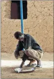  ?? AP PHOTO ?? A young migrant who has been expelled from Algeria sits in a transit center in Arlit, Niger on Friday. Traumatize­d by his experience, he has not spoken and is helped by other migrants for food and bathing. His case puzzles aid workers who cannot find...