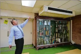  ?? ROGELIO V. SOLIS/AP PHOTO ?? Jim Hill High School principal Bobby Brown points out one of the outdated air-condition units that are installed throughout the Jackson, Miss., school.