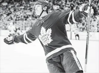  ?? CARLOS OSORIO TORONTO STAR ?? Mitch Marner celebrates his first-period goal against the Senators in a five-point night for the Maple Leafs.