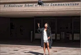  ?? Emily Kenny ?? Times Union reporter Shrishti Mathew tossing her cap at her graduation from the Newhouse School at Syracuse University.