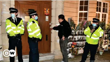  ??  ?? Myanmar envoy to the UK Kyaw Zwar Minn tries unsuccessf­ully to enter the embassy in London