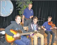  ?? DESIREE ANSTEY/ JOURNAL PIONEER ?? Tianna Gallant, left, Dawson Arsenault and Gilbert Arsenault from the band Paloudes, with Théodore Theriault at the 23rd annual Club Richelieu Évangéline social in Abrams Village.