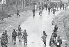  ?? PTI ?? A group of youth pelting stones on security forces . It is time our rulers realise that the stage is getting set in Kashmir for hostilitie­s even more intense than early November 1947 — when tribesmen from Pakistan were pushed back from Srinagar