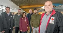  ?? KAVINDA HERATH/STUFF ?? Red Cross staff and volunteers await the Colombian former refugees at Invercargi­ll Airport. From left are Mauricio Convers, Marcel Dore, Celina Dore, Gavin Booth, Craig Glen and Darren Frazer.