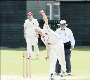  ?? Picture: Andy Payton FM4428654 ?? Tim Curteis bowls as Tenterden undertake the forlorn task of trying to deny leaders Hartley victory on Saturday