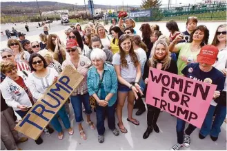  ?? Mel Evans / Associated Press ?? Despite Donald Trump’s recent comments, a group of women show their support for the GOP front-runner at a rally earlier this week in Wilkes-Barre, Pa.