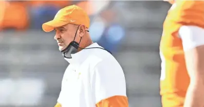  ?? BRIANNA PACIORKA/POOL VIA NEWS SENTINEL ?? Tennessee Head Coach Jeremy Pruitt walks on the field before a game between Tennessee and Texas A&M in Neyland Stadium in Knoxville, Saturday, Dec. 19, 2020.