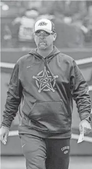  ?? OSU ATHLETICS]
[PHOTO COURTESY OF BRUCE WATERFIELD, ?? Kenny Gajewski, pictured inside the Cowgirl Softball Complex, has helped lead a resurgence of the program in just his second year as coach.