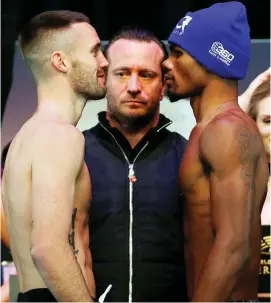  ??  ?? Eyeing up: Taylor and Martin go toe-to-toe at their weigh-in