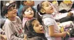  ??  ?? Kids enjoy Very Young People’s Concert: Philharmon­ic Playdates at Casita Maria.