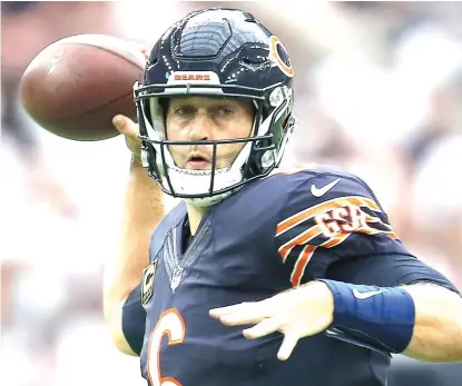 ?? | GETTY IMAGES ?? Jay Cutler is signed for the next four seasons, but the Bears would take a salary- cap hit of only $ 2 million if they let him go.