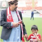  ??  ?? Proud moment Sudais with adoptive father Mohammad Asif before the match