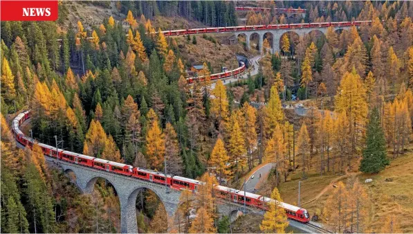  ?? PHILIPP SCHMIDLI/SWISS-IMAGE.CH ?? Taken from a helicopter, this view shows the 100-car Rhaetian Railway train winding round the spiral curves and viaducts of the Albula Valley during the successful world record attempt on October 29.
